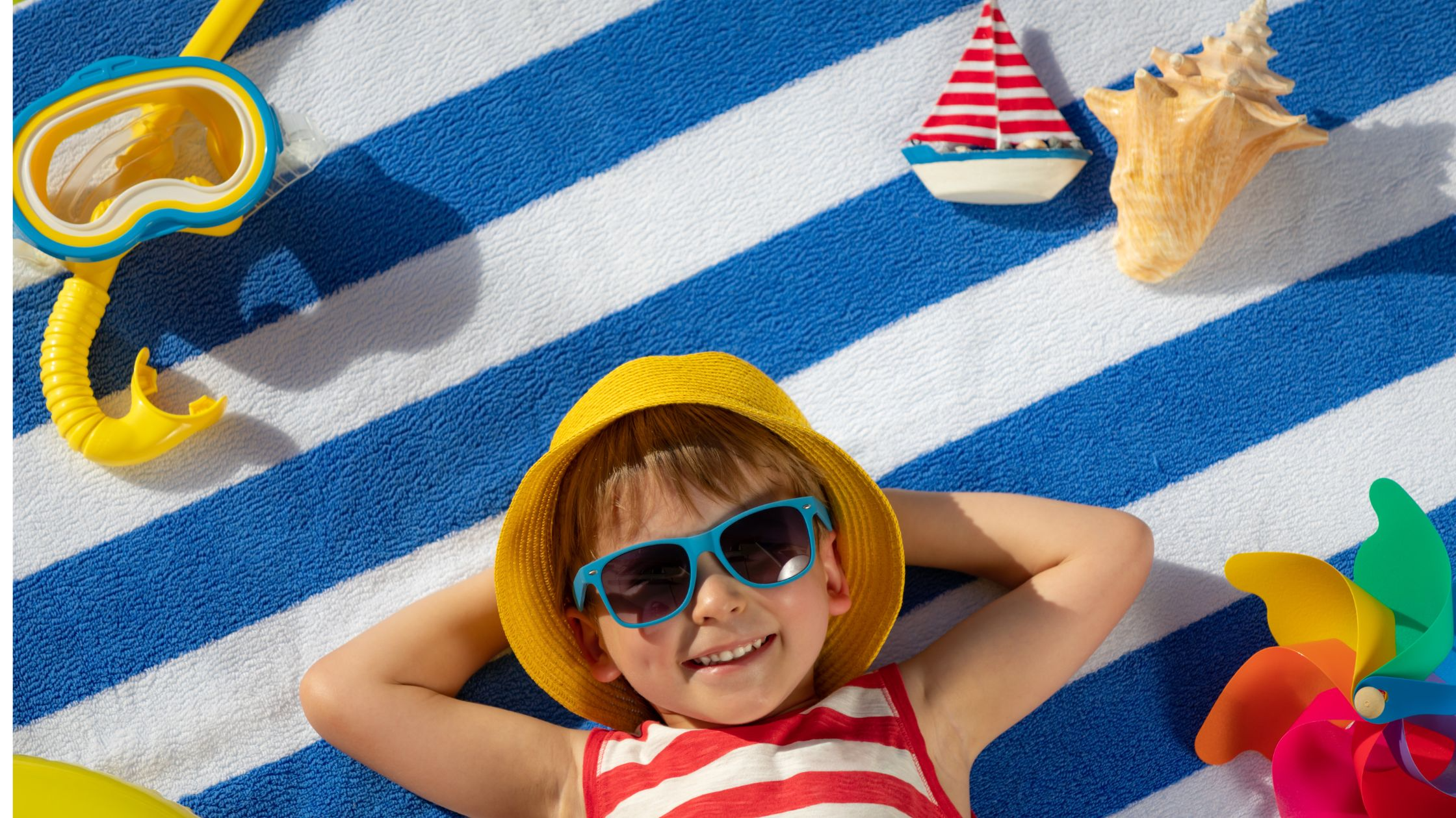 photo of a child relaxing in sunglasses on summer break
